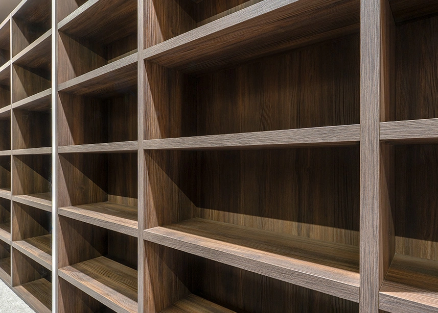 Empty wooden shelving unit with multiple compartments and cubby holes for storage and organization - Custom carpentry in the DC Metro area.