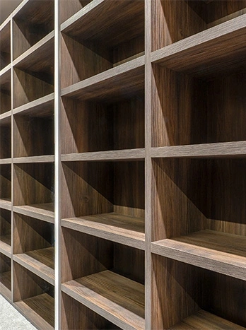 Empty wooden shelving unit with multiple compartments and cubby holes for storage and organization - Custom carpentry in the DC Metro area.